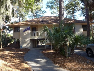 Desirable Duplex Style villa overlooking a scenic pond in gated on The Plantation Course At Edisto in South Carolina - for sale on GolfHomes.com, golf home, golf lot