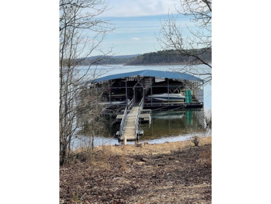 Welcome to your dream retreat--a stunning lakefront home in the on Tannenbaum Golf Club in Arkansas - for sale on GolfHomes.com, golf home, golf lot