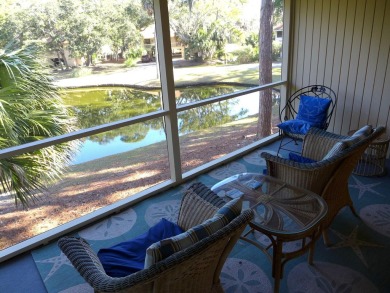 Desirable Duplex Style villa overlooking a scenic pond in gated on The Plantation Course At Edisto in South Carolina - for sale on GolfHomes.com, golf home, golf lot