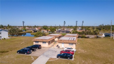Quadruple your income with this fully rented WATERFRONT QUADPLEX on Rotonda Golf and Country Club The Hills Course in Florida - for sale on GolfHomes.com, golf home, golf lot
