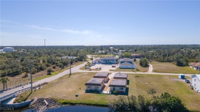 Quadruple your income with this fully rented WATERFRONT QUADPLEX on Rotonda Golf and Country Club The Hills Course in Florida - for sale on GolfHomes.com, golf home, golf lot