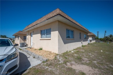 Quadruple your income with this fully rented WATERFRONT QUADPLEX on Rotonda Golf and Country Club The Hills Course in Florida - for sale on GolfHomes.com, golf home, golf lot