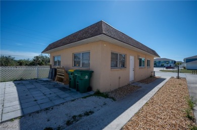 Quadruple your income with this fully rented WATERFRONT QUADPLEX on Rotonda Golf and Country Club The Hills Course in Florida - for sale on GolfHomes.com, golf home, golf lot