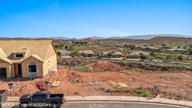 Experience breathtaking views of the city, mountains, and golf on Coral Canyon Golf Course in Utah - for sale on GolfHomes.com, golf home, golf lot