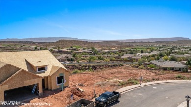 Experience breathtaking views of the city, mountains, and golf on Coral Canyon Golf Course in Utah - for sale on GolfHomes.com, golf home, golf lot