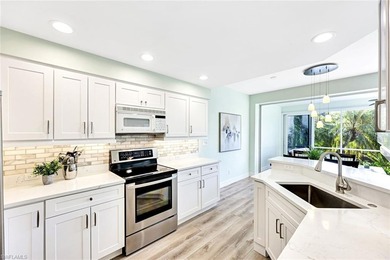 Wake up to tranquil south-facing lake views in this beautifully on Bonita Bay West in Florida - for sale on GolfHomes.com, golf home, golf lot