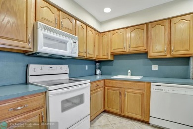 Discover your dream home in this beautiful 2BR, 2BA condo on Palm-Aire Country Club and Resort - Palms in Florida - for sale on GolfHomes.com, golf home, golf lot