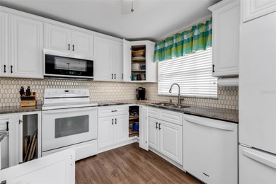 NICELY UPDATED and VERY WELL MAINTAINED Sheffield model with on Kings Gate Golf Club in Florida - for sale on GolfHomes.com, golf home, golf lot