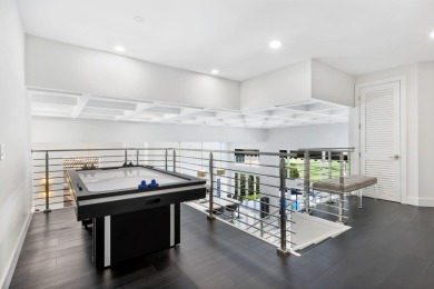 Experience unparalleled luxury in this modern masterpiece on Woodfield Country Club in Florida - for sale on GolfHomes.com, golf home, golf lot