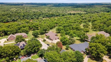 Live the life you've imagined. This spectacular home nestled in on Pecan Plantation Country Club in Texas - for sale on GolfHomes.com, golf home, golf lot