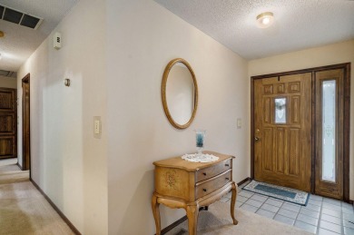 This one's been loved and it shows. Solid all brick home with on Horton Smith Golf Course in Missouri - for sale on GolfHomes.com, golf home, golf lot