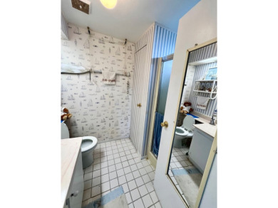 Welcome to this 2-bedroom, 2-bathroom home located in the gated on Pine Lakes Country Club in Florida - for sale on GolfHomes.com, golf home, golf lot