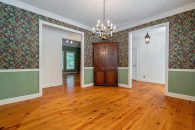 DISCOVER TIMELESS SOUTHERN ELEGANCE AND LUXURY LAKEFRONT LIVING on Great Waters Course At Reynolds Plantation in Georgia - for sale on GolfHomes.com, golf home, golf lot