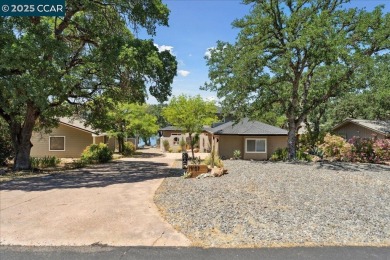 This charming 3-bedroom house on Hidden Valley Lake offers a on Hidden Valley Lake Golf and Country Club in California - for sale on GolfHomes.com, golf home, golf lot