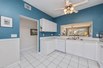 Light and bright first-floor END UNIT with serene lake views in on Glen Eagle Golf and Country Club in Florida - for sale on GolfHomes.com, golf home, golf lot