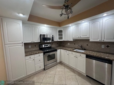 Enjoy breathtaking views of the golf course from your screened on Palm-Aire Country Club and Resort - The Oaks in Florida - for sale on GolfHomes.com, golf home, golf lot