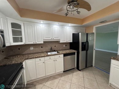 Enjoy breathtaking views of the golf course from your screened on Palm-Aire Country Club and Resort - The Oaks in Florida - for sale on GolfHomes.com, golf home, golf lot