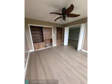 Enjoy breathtaking views of the golf course from your screened on Palm-Aire Country Club and Resort - The Oaks in Florida - for sale on GolfHomes.com, golf home, golf lot