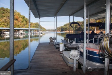 Nestled at the end of a serene cul-de-sac, this charming house on Lanier Island Legacy Golf Couorse in Georgia - for sale on GolfHomes.com, golf home, golf lot