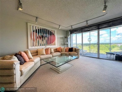 Located in the highly sought-after Palm Aire Country Club, this on Palm-Aire Country Club and Resort - Palms in Florida - for sale on GolfHomes.com, golf home, golf lot