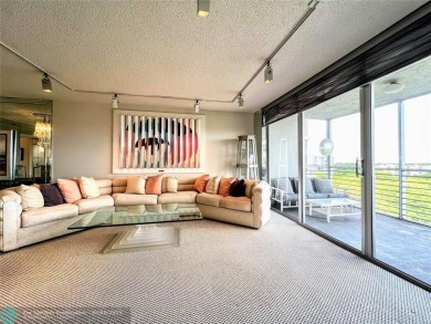 Located in the highly sought-after Palm Aire Country Club, this on Palm-Aire Country Club and Resort - Palms in Florida - for sale on GolfHomes.com, golf home, golf lot