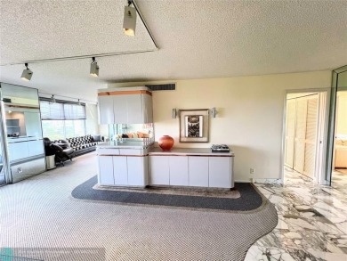 Located in the highly sought-after Palm Aire Country Club, this on Palm-Aire Country Club and Resort - Palms in Florida - for sale on GolfHomes.com, golf home, golf lot