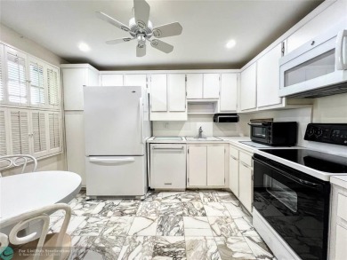 Located in the highly sought-after Palm Aire Country Club, this on Palm-Aire Country Club and Resort - Palms in Florida - for sale on GolfHomes.com, golf home, golf lot