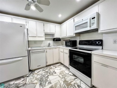 Located in the highly sought-after Palm Aire Country Club, this on Palm-Aire Country Club and Resort - Palms in Florida - for sale on GolfHomes.com, golf home, golf lot