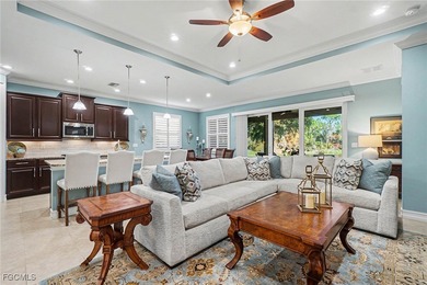 MOVE-IN READY | MAJOR UPGRADES | GOLF & WATER VIEWS! This on Herons Glen Golf and Country Club in Florida - for sale on GolfHomes.com, golf home, golf lot