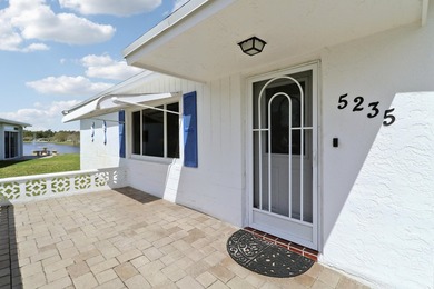 Welcome to one of the most unique waterfront homes in Cypress on Cypress Lakes Golf Course - West Palm Beach in Florida - for sale on GolfHomes.com, golf home, golf lot