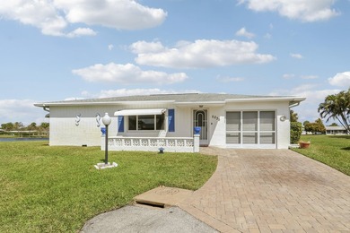 Welcome to one of the most unique waterfront homes in Cypress on Cypress Lakes Golf Course - West Palm Beach in Florida - for sale on GolfHomes.com, golf home, golf lot