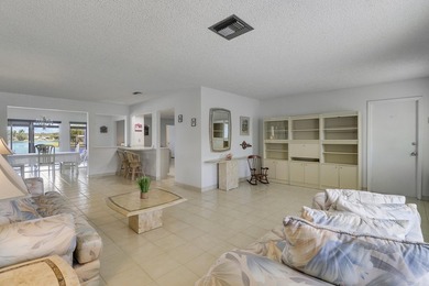 Welcome to one of the most unique waterfront homes in Cypress on Cypress Lakes Golf Course - West Palm Beach in Florida - for sale on GolfHomes.com, golf home, golf lot