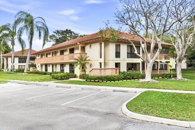 Beautiful first-floor end-unit Golf villa in the sought-after on PGA National Golf Club in Florida - for sale on GolfHomes.com, golf home, golf lot
