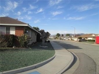 This is a nice property with an additional room which is the on Panorama Village Golf Course in California - for sale on GolfHomes.com, golf home, golf lot