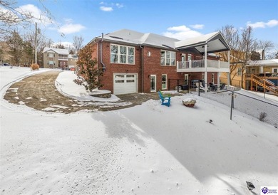 Welcome to 190 Strawberry Circle, a rare lakefront home for sale on Doe Valley Country Club in Kentucky - for sale on GolfHomes.com, golf home, golf lot