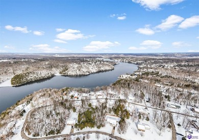 Welcome to 190 Strawberry Circle, a rare lakefront home for sale on Doe Valley Country Club in Kentucky - for sale on GolfHomes.com, golf home, golf lot