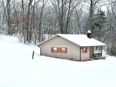 Welcome to your perfect little getaway! This charming cottage on Carnico Golf Course in Kentucky - for sale on GolfHomes.com, golf home, golf lot