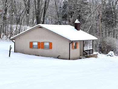 Welcome to your perfect little getaway! This charming cottage on Carnico Golf Course in Kentucky - for sale on GolfHomes.com, golf home, golf lot