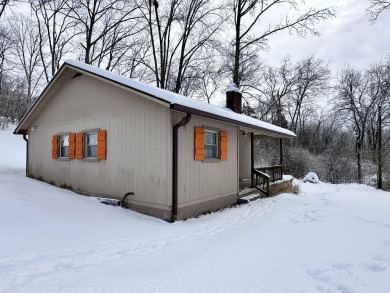 Welcome to your perfect little getaway! This charming cottage on Carnico Golf Course in Kentucky - for sale on GolfHomes.com, golf home, golf lot