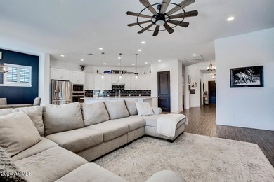 Tucked within the exclusive gated community of Verrado Highlands on Verrado Golf Club - Victory in Arizona - for sale on GolfHomes.com, golf home, golf lot