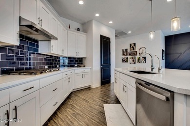 Tucked within the exclusive gated community of Verrado Highlands on Verrado Golf Club - Victory in Arizona - for sale on GolfHomes.com, golf home, golf lot