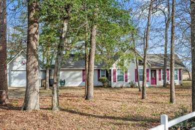 Tucked away on a beautifully wooded lot in the heart of East on Holly Lake Ranch Golf Club in Texas - for sale on GolfHomes.com, golf home, golf lot