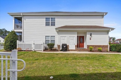 This inviting second-floor condo in the gated community of on Brunswick Plantation and Golf Resorts in North Carolina - for sale on GolfHomes.com, golf home, golf lot