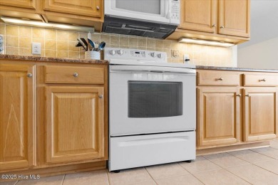 This inviting second-floor condo in the gated community of on Brunswick Plantation and Golf Resorts in North Carolina - for sale on GolfHomes.com, golf home, golf lot