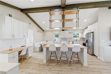 Step into a home where modern luxury meets timeless character on Royal Tee Country Club in Florida - for sale on GolfHomes.com, golf home, golf lot