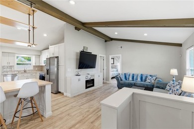 Step into a home where modern luxury meets timeless character on Royal Tee Country Club in Florida - for sale on GolfHomes.com, golf home, golf lot