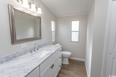 Newly renovated oversized single-wide manufactured home situated on Prestwick Country Club in South Carolina - for sale on GolfHomes.com, golf home, golf lot