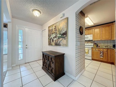This Crown model is priced to sell. Home is being sold furnished on Kings Ridge Golf Club in Florida - for sale on GolfHomes.com, golf home, golf lot
