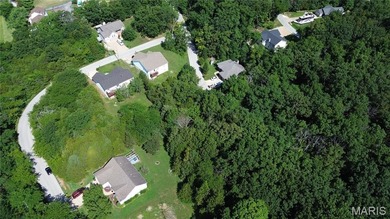 Discover an incredible opportunity with this buildable level lot on Raintree Country Club in Missouri - for sale on GolfHomes.com, golf home, golf lot