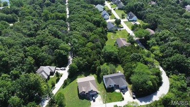Discover an incredible opportunity with this buildable level lot on Raintree Country Club in Missouri - for sale on GolfHomes.com, golf home, golf lot
